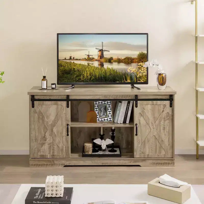 Meuble TV de style rustique avec portes coulissantes façon porte de grange et étagères réglables pour téléviseurs jusqu'à 65 pouces